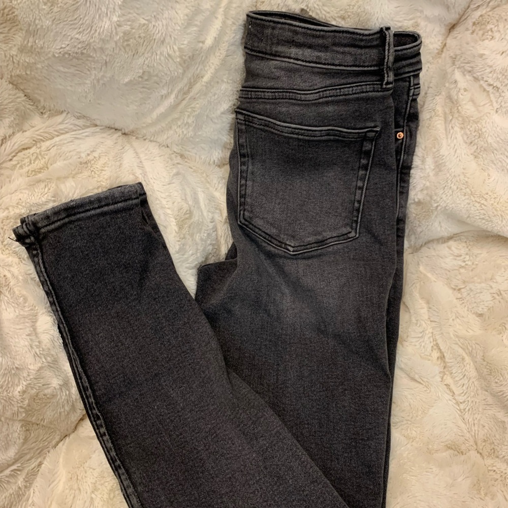 Washed, black, stretchy skinny jeans by Mango. US size 6.